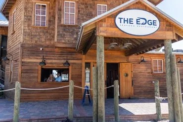 Wooden building with a sign reading 'The Edge' above the entrance.